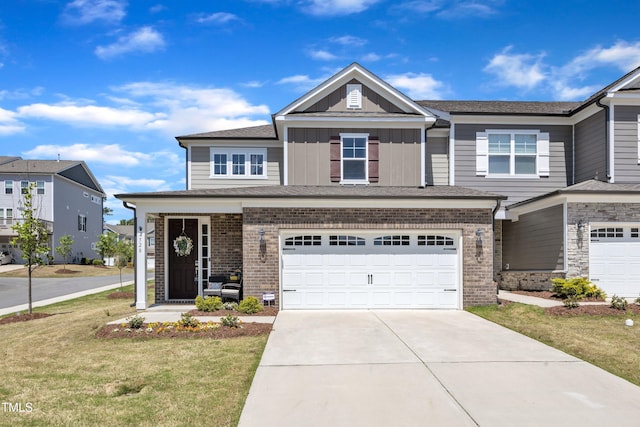 view of front of house featuring a front lawn, board and batten siding, driveway, brick siding, and a garage