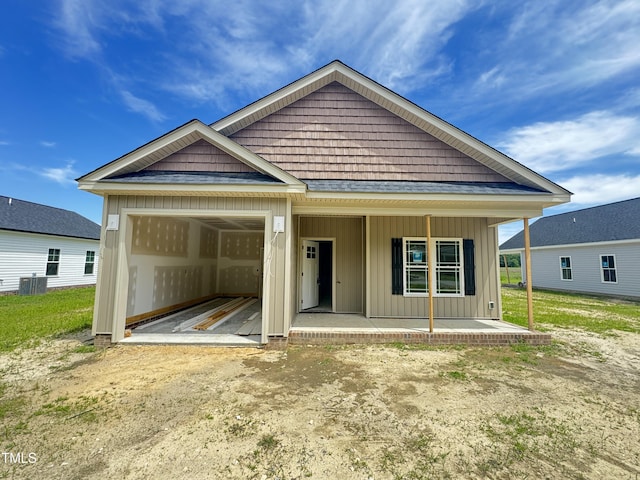 502 S Vance St, Fremont, NC 27830 - view of front facade featuring board and batten siding, a garage, and a porch