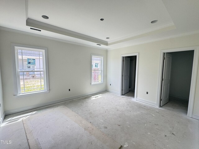 502 S Vance St, Fremont, NC 27830 - unfurnished bedroom with a tray ceiling, ornamental molding, and baseboards