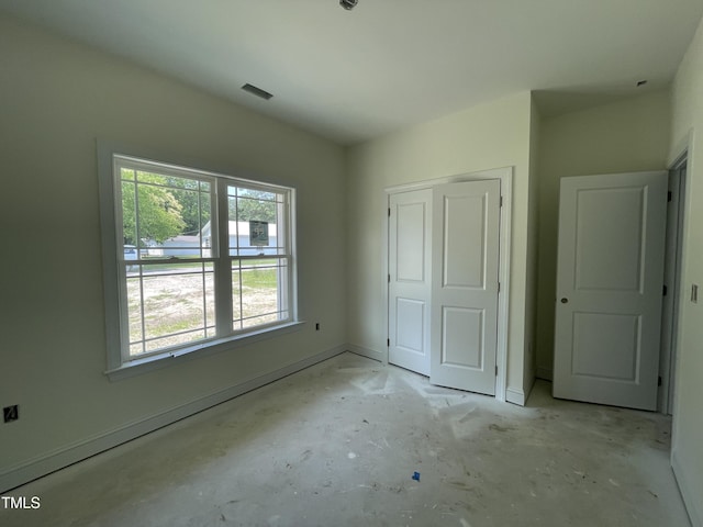 502 S Vance St, Fremont, NC 27830 - unfurnished bedroom with a closet, unfinished concrete flooring, and baseboards