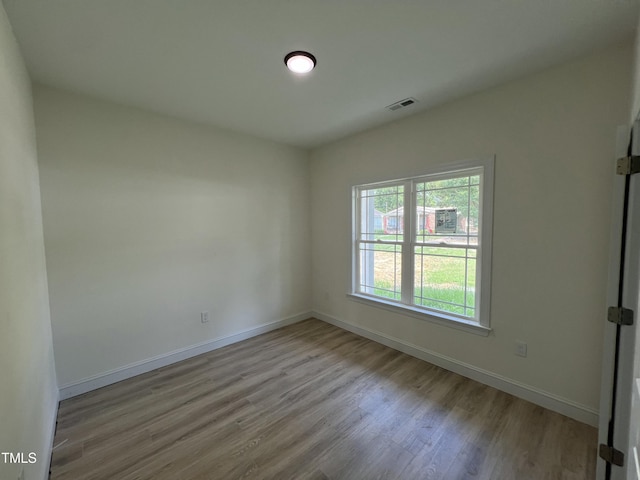 502 S Vance St, Fremont, NC 27830 - empty room with wood finished floors and baseboards