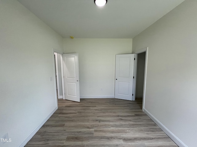 502 S Vance St, Fremont, NC 27830 - unfurnished bedroom with wood finished floors