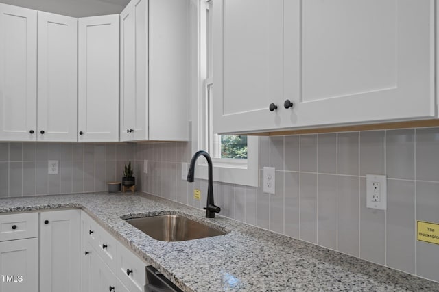 111 Halifax Rd, Louisburg, NC 27549 - kitchen with a sink, decorative backsplash, white cabinetry, and light stone counters
