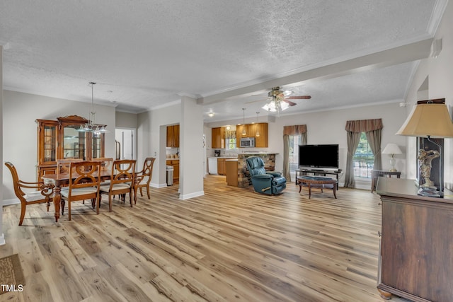 2265 Bud Lipscomb Rd, Willow Springs, NC 27592 - living room with a textured ceiling, a ceiling fan, light wood-style floors, and ornamental molding