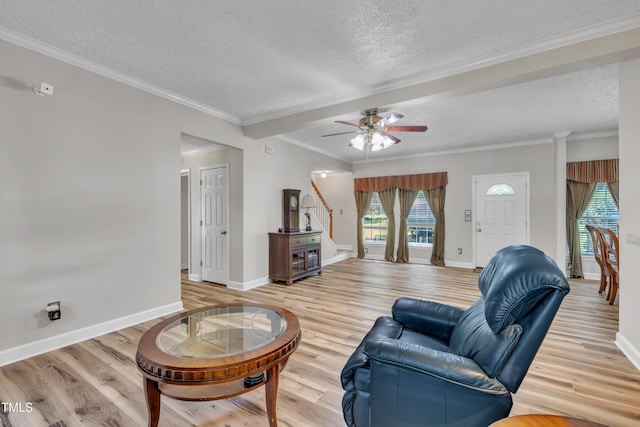 2265 Bud Lipscomb Rd, Willow Springs, NC 27592 - living room with a textured ceiling, stairway, light wood-type flooring, ceiling fan, and crown molding