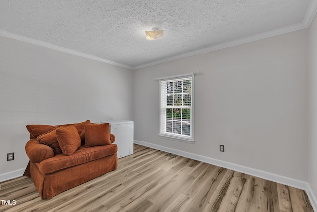 2265 Bud Lipscomb Rd, Willow Springs, NC 27592 - sitting room with light wood-style flooring, a textured ceiling, and crown molding