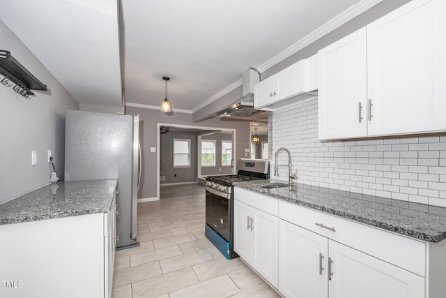 kitchen with crown molding, tasteful backsplash, a sink, stainless steel appliances, and wall chimney exhaust hood