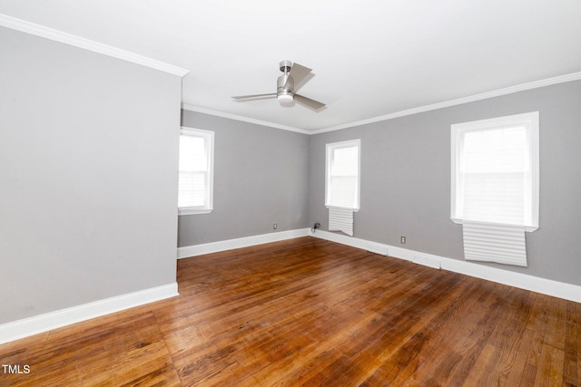 unfurnished room featuring crown molding, baseboards, a ceiling fan, and wood finished floors