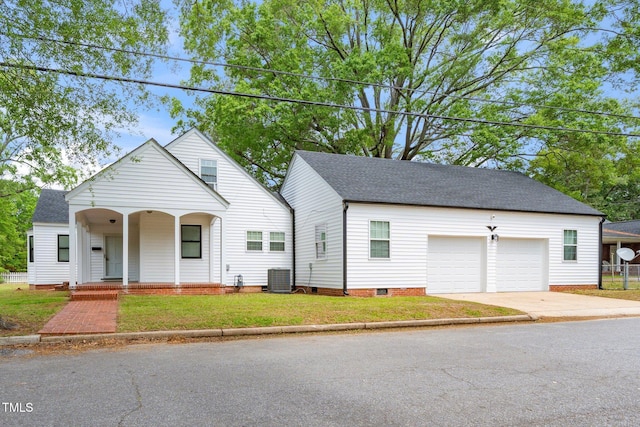 view of front facade with a garage, crawl space, concrete driveway, cooling unit, and covered porch