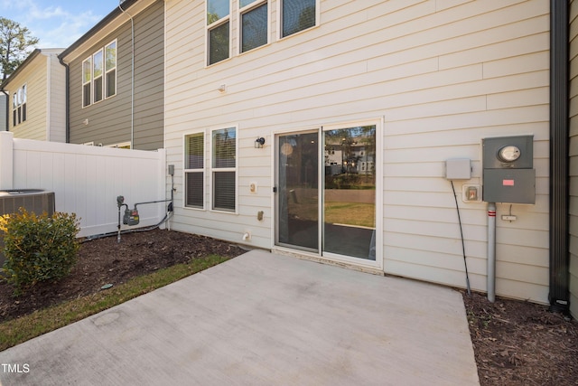 back of house featuring a patio area, central air condition unit, and fence