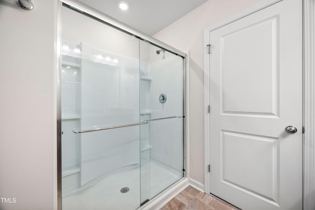 bathroom featuring a shower stall and recessed lighting