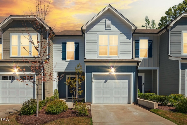 view of front of property with a garage and concrete driveway