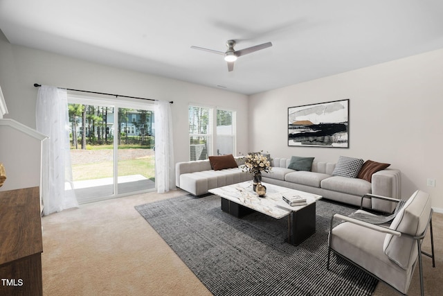 living area featuring ceiling fan and carpet floors