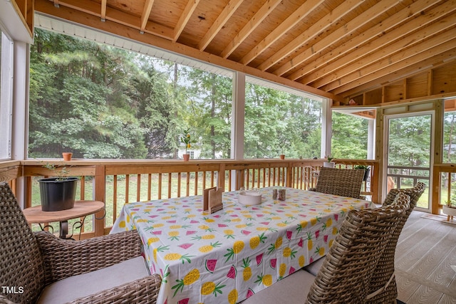 sunroom featuring outdoor dining space