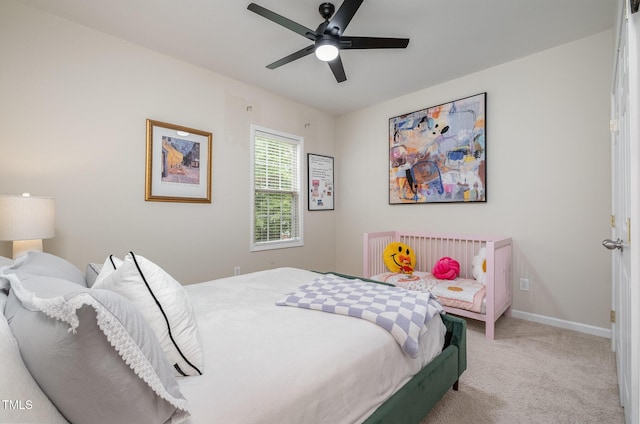 bedroom featuring baseboards, carpet flooring, and ceiling fan