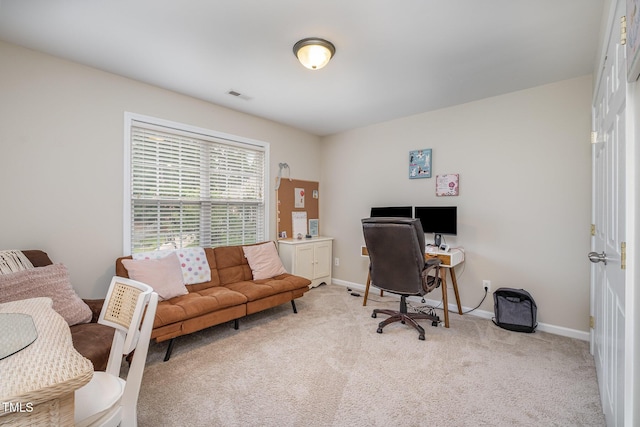 office space featuring carpet, visible vents, and baseboards