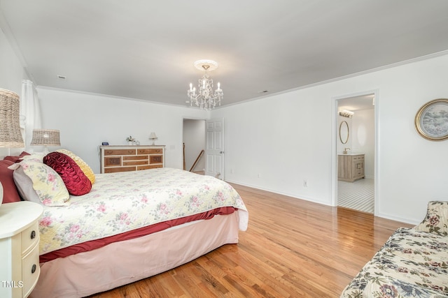 bedroom featuring crown molding, baseboards, an inviting chandelier, and wood finished floors