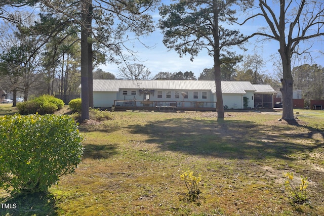 view of front facade with metal roof and a deck