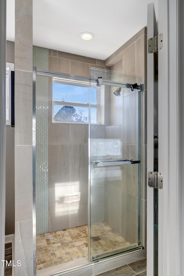 bathroom with a shower stall