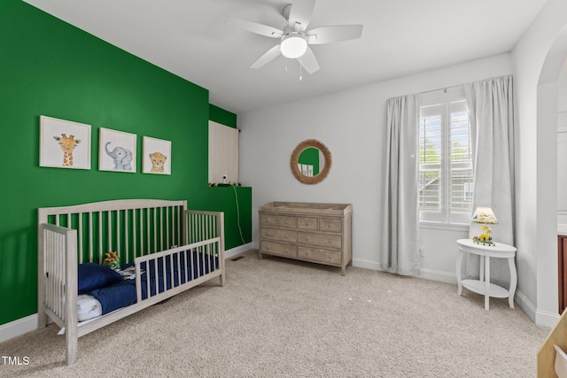 5928 Terrington Ln, Raleigh, NC 27606 - bedroom with a nursery area, ceiling fan, baseboards, and carpet floors