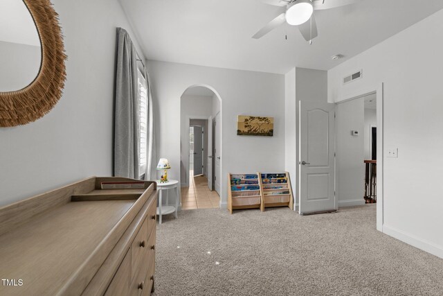 5928 Terrington Ln, Raleigh, NC 27606 - bedroom with visible vents, baseboards, arched walkways, a ceiling fan, and light carpet