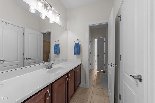 5928 Terrington Ln, Raleigh, NC 27606 - bathroom featuring tile patterned floors, vanity, and baseboards