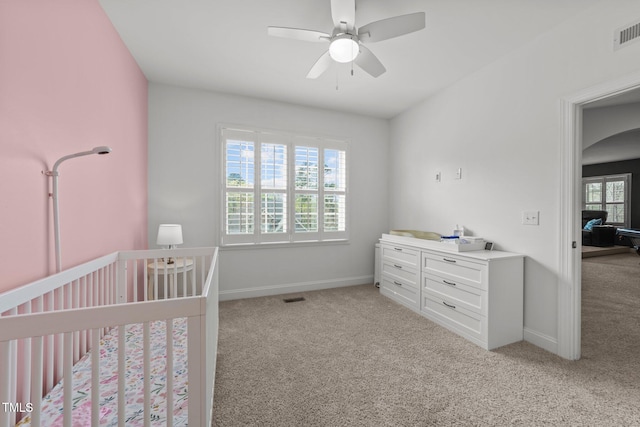 5928 Terrington Ln, Raleigh, NC 27606 - bedroom with light colored carpet, baseboards, visible vents, and a nursery area