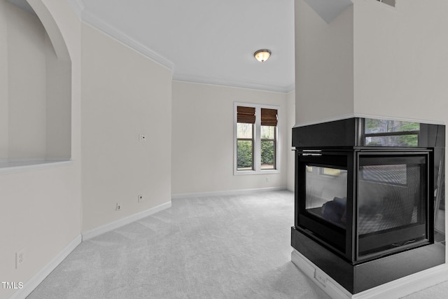 5928 Terrington Ln, Raleigh, NC 27606 - unfurnished living room with baseboards, arched walkways, a multi sided fireplace, crown molding, and carpet flooring