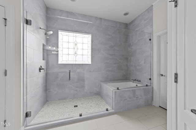 5928 Terrington Ln, Raleigh, NC 27606 - bathroom featuring tile patterned floors, a relaxing tiled tub, and a stall shower