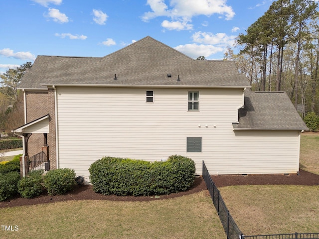 5928 Terrington Ln, Raleigh, NC 27606 - view of property exterior featuring a shingled roof and a lawn