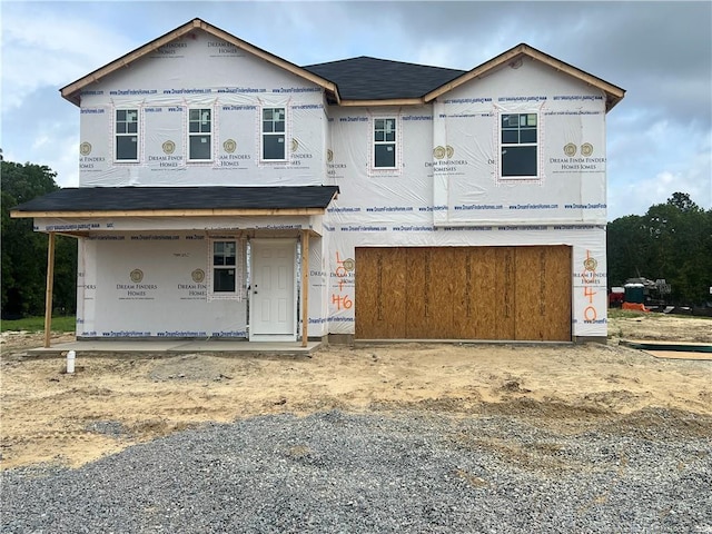 1040 Emerald Stone Loop, Hope Mills, NC 28348 - property in mid-construction with an attached garage, driveway, a porch, and a shingled roof