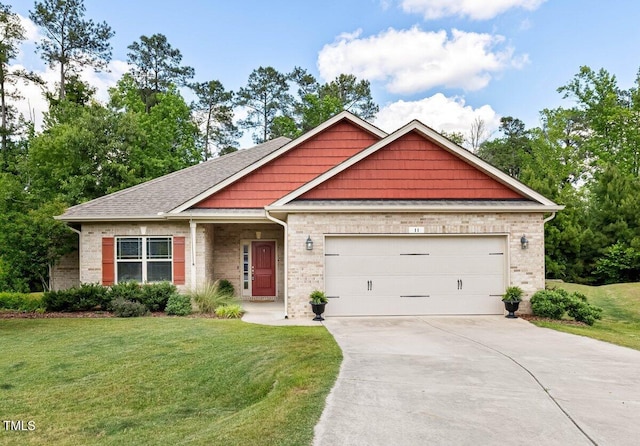 view of front facade featuring driveway, a front yard, an attached garage, and brick siding