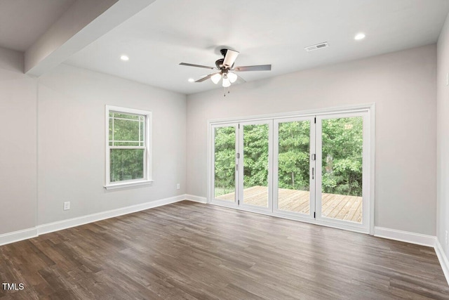 empty room featuring ceiling fan, baseboards, dark wood-style flooring, and recessed lighting