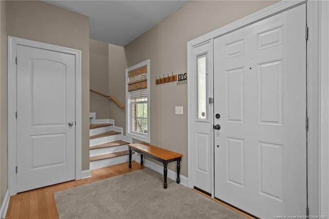 887 Thrush Dr, Vass, NC 28394 - entryway with baseboards, light wood-type flooring, and stairs