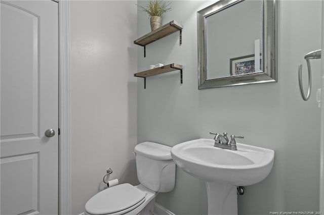 887 Thrush Dr, Vass, NC 28394 - half bath featuring toilet, baseboards, and a sink