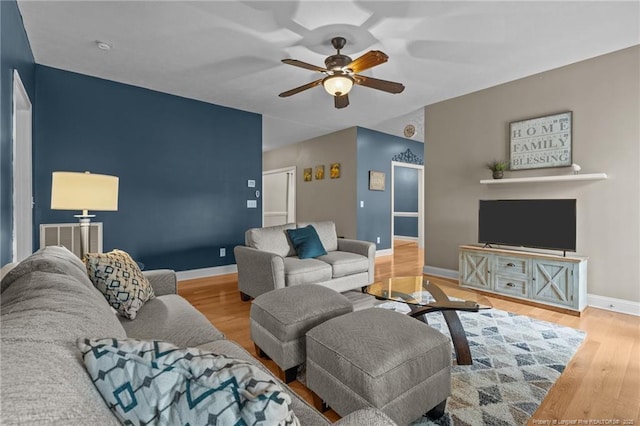 887 Thrush Dr, Vass, NC 28394 - living area with baseboards, a ceiling fan, wood finished floors, and visible vents