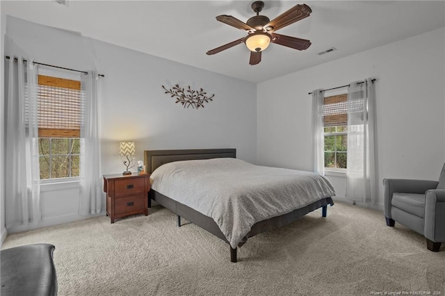 887 Thrush Dr, Vass, NC 28394 - bedroom with visible vents, carpet, ceiling fan, and baseboards