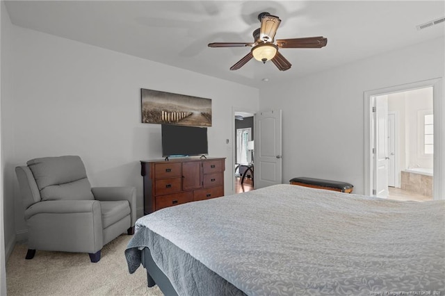 887 Thrush Dr, Vass, NC 28394 - bedroom featuring light carpet, a ceiling fan, connected bathroom, and visible vents