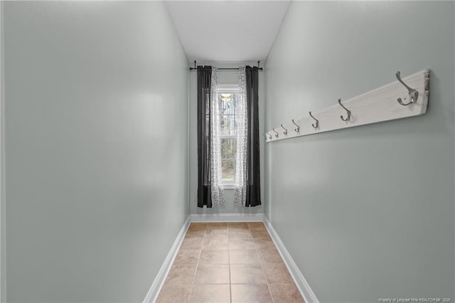 887 Thrush Dr, Vass, NC 28394 - doorway with baseboards and tile patterned flooring