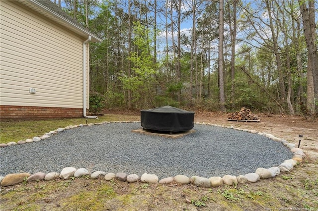 887 Thrush Dr, Vass, NC 28394 - view of yard with an outdoor fire pit
