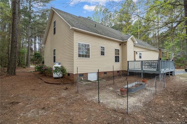887 Thrush Dr, Vass, NC 28394 - rear view of house with crawl space, a wooden deck, and roof with shingles