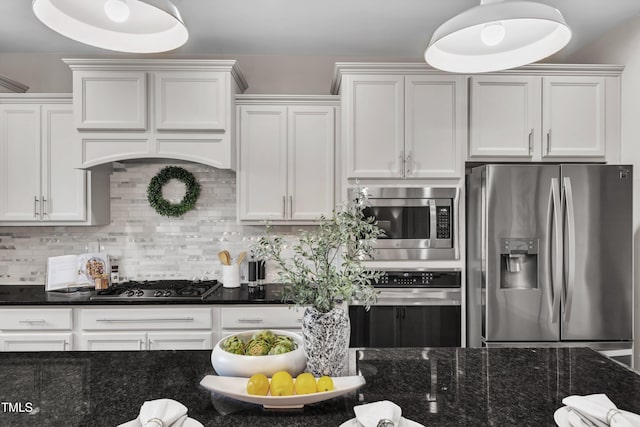 706 Fireball Ct, Knightdale, NC 27545 - kitchen with stainless steel appliances, premium range hood, white cabinets, decorative backsplash, and dark stone counters