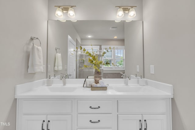 706 Fireball Ct, Knightdale, NC 27545 - bathroom with double vanity and a shower with shower door