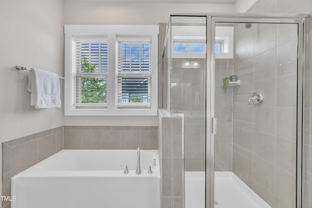 706 Fireball Ct, Knightdale, NC 27545 - full bath featuring a garden tub, plenty of natural light, and a shower stall