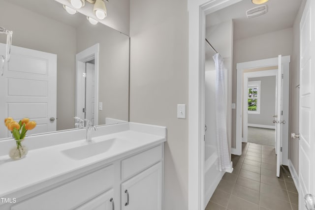 706 Fireball Ct, Knightdale, NC 27545 - full bath featuring vanity, tile patterned floors, shower / tub combo, and baseboards