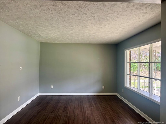 5704 Selkirk Pl, Fayetteville, NC 28304 - unfurnished room with dark wood-type flooring, a textured ceiling, and baseboards