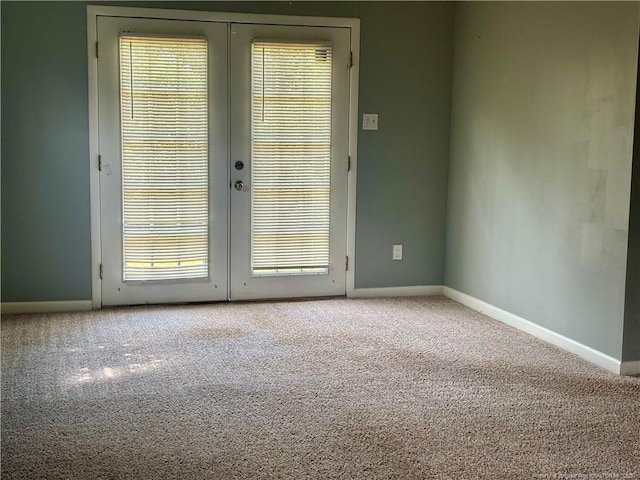 5704 Selkirk Pl, Fayetteville, NC 28304 - empty room featuring french doors, baseboards, and carpet