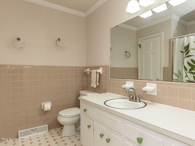 full bath with toilet, crown molding, vanity, and visible vents