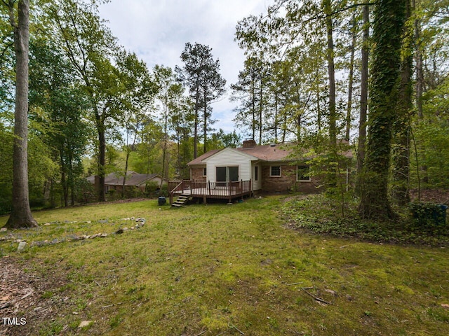 view of yard with a wooden deck