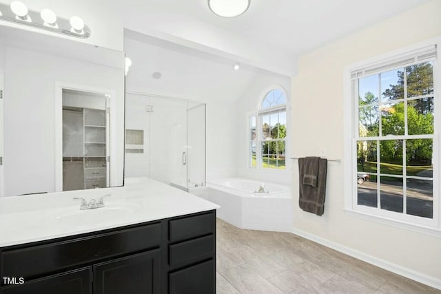102 Cockleshell Ct, Cary, NC 27513 - bathroom with lofted ceiling with beams, a shower stall, a bath, vanity, and baseboards